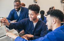 Apprentices working on computers