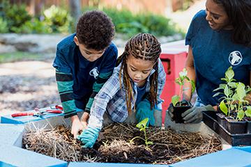Children planting a community garden