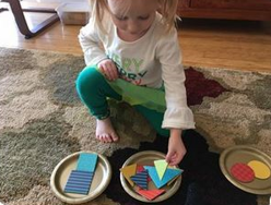 Image of girl playing with shapes
